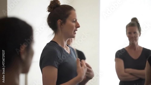 Therapist leading breathing exercise with group of adults