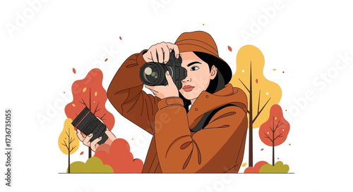 Photographer holding camera in a beautiful autumn forest taking a picture