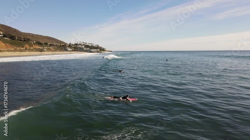 Surfing riding wave at county line beach Malibu Los Angeles