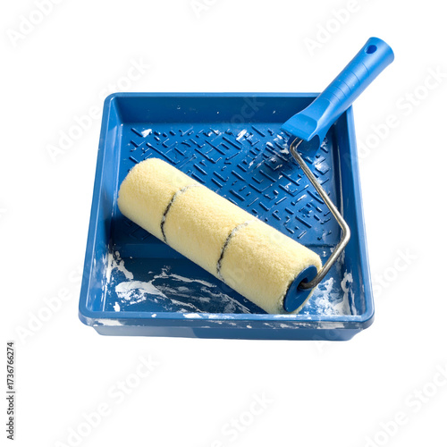 Blue paint tray containing a paint roller and a handle resting with white paint stains isolated against a solid black background, showcasing a bright color palette and a minimalist composition.