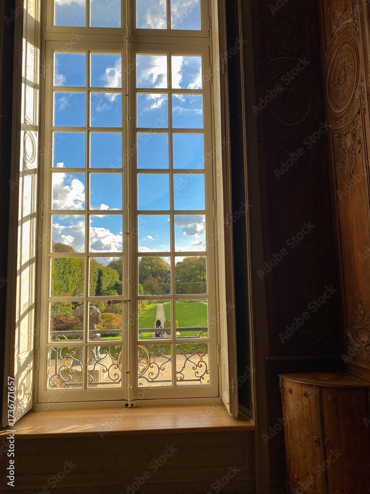 Fototapeta premium Scenic Garden View through Elegant Window