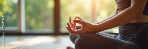 Wallpaper Mural Woman doing yoga pose with hands in gyan mudra seated in front of large window for quiet meditation. Yoga session includes relaxed breathing, mindfulness, and healthy lifestyle habits. Torontodigital.ca