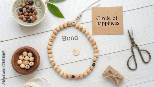 Wooden beaded loop with label and other elements in flat lay