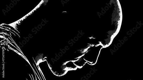 Dramatic high-contrast silhouette of a pensive person looking down, evoking introspection and solemn contemplation in black and white.