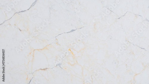 Light beige marble creating an elegant background with natural gold and grey veins, offering a luxurious texture for various design and architectural applications