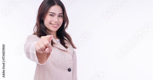 Confident asian woman pointing finger looking front virtual gesture technology touch screen standing with copyspace over isolated white background. Positive worker female sign model technology success