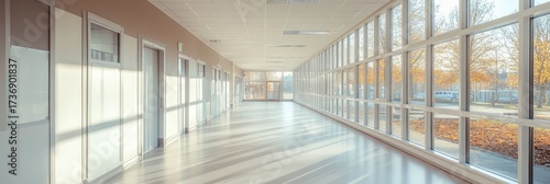 A large, empty hallway with a lot of windows