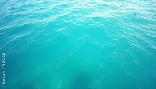 Fototapeta Naklejka Na Ścianę i Meble -  Teal Ocean Water Ripples Calmly on Sunny Day