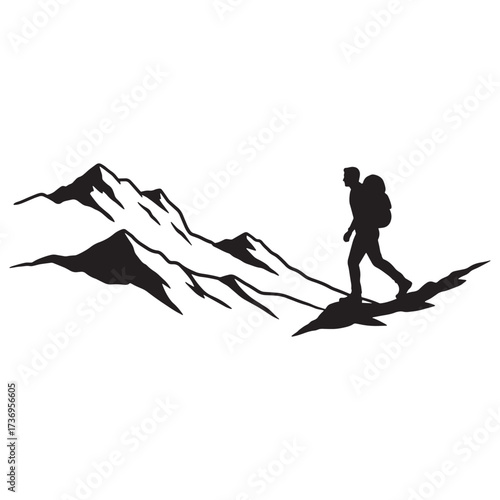 Hiker silhouette against a jagged mountain range panorama