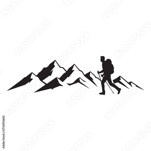 Hiker silhouette against a mountain range panorama