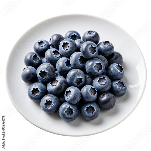 Pile of fresh, plump blueberries on a white plate, ready to eat