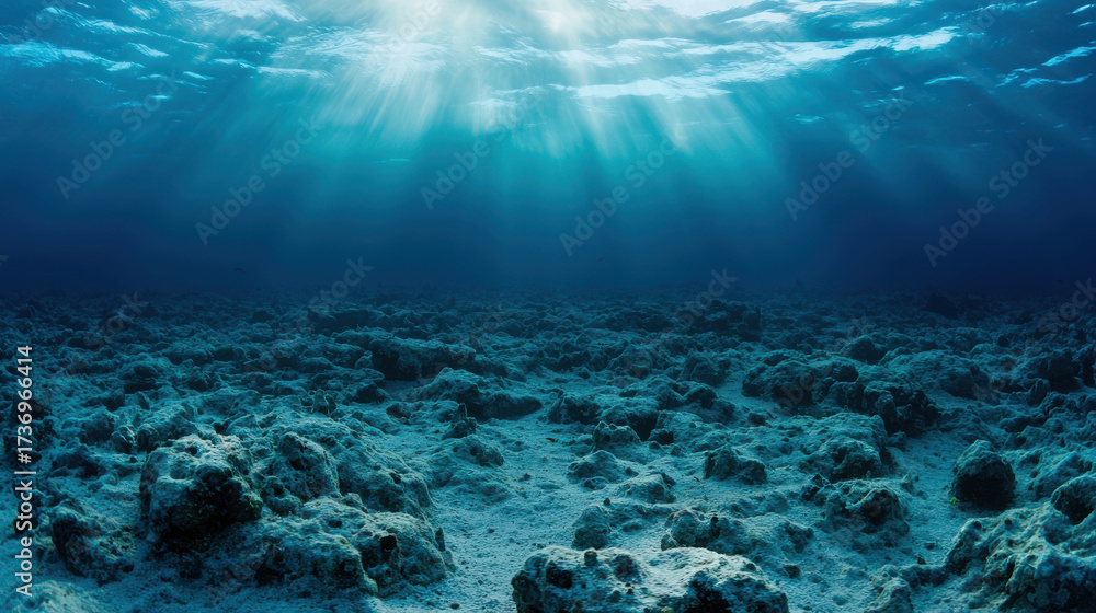 Fototapeta premium Sunlight Illuminates Rustic Ocean Floor Featuring Coral and Sand in Tranquil Blue Water, Creating a Serene Underwater Landscape