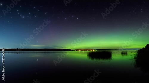 Starry sky and the Northern Lights over the river, the night lights of the ships