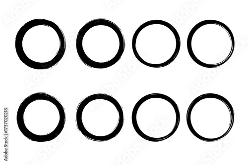 Set of black grunge circles. Round frames with brush stroke texture. Hand drawn ink stamp shapes. Distressed dirty paint border collection. Abstract vector design elements.