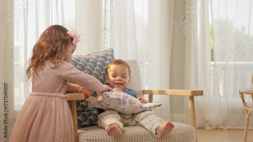 Adorable Toddler Giving Wrapped Gift to Baby