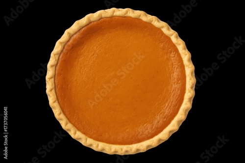 Pumpkin pie with golden crust on black background  