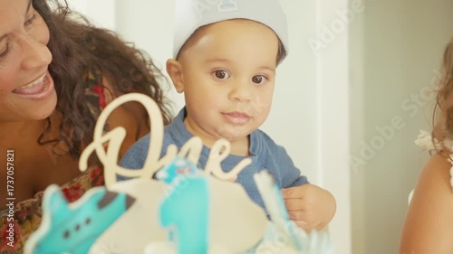 One Year Old Baby Looking at Birthday Cake