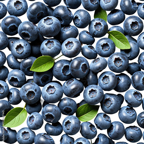 Close-up of fresh, ripe blueberries & a few green leaves