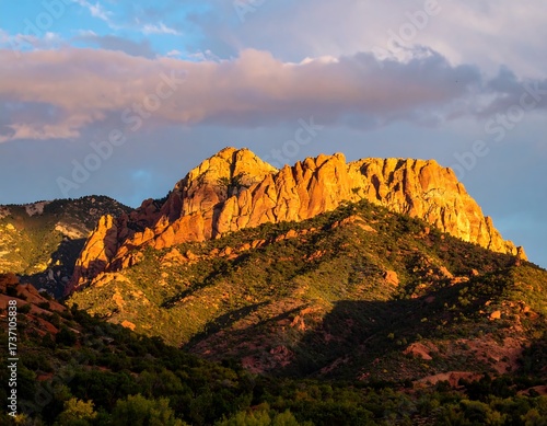Mountain peak bathed in golden sunlight
