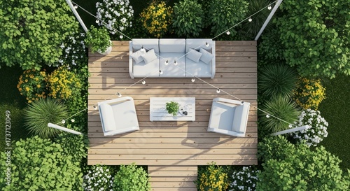 Overhead view reveals a modern outdoor living space, featuring a wooden deck with stylish white furniture, surrounded by lush green landscaping and vibrant yellow and white flowering plants,...