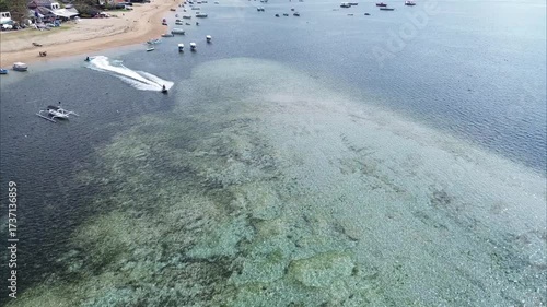 Aerial view of tourists enjoying water rides in Tanjung Benoa, Bali.