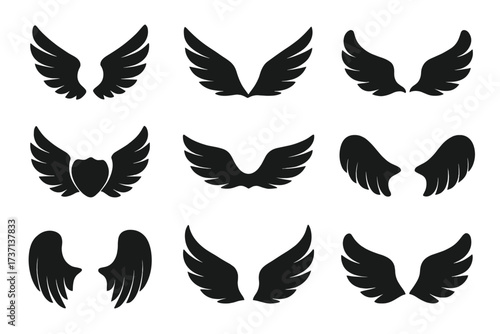Set of black wing icons. Vector collection of angel or bird wings silhouettes. Heraldic signs, emblems, tattoos, or logo design elements. Freedom and flight symbols.