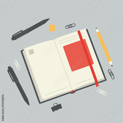 Open notebook with blank pages surrounded by stationery items.