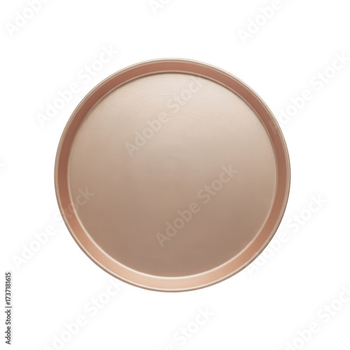 A simple round copper tray with a dark background