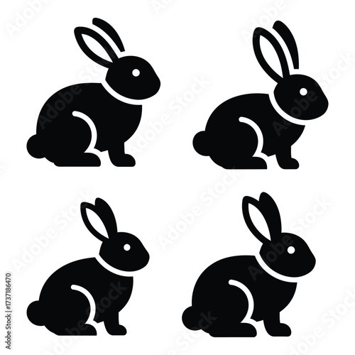 Four black silhouette rabbits sitting easter spring animals cute domestic farm mammals wildlife nature cute pets silhouette
