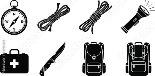 Essential camping and outdoor gear includes compass, rope, flashlight, first aid kit, knife and backpack 