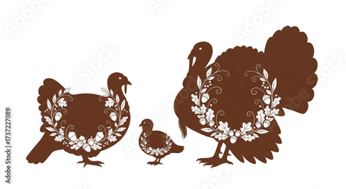 Elegant decorative brown turkey silhouettes, male, female, chick, with white oak leaf and acorn wreaths. Thanksgiving art.