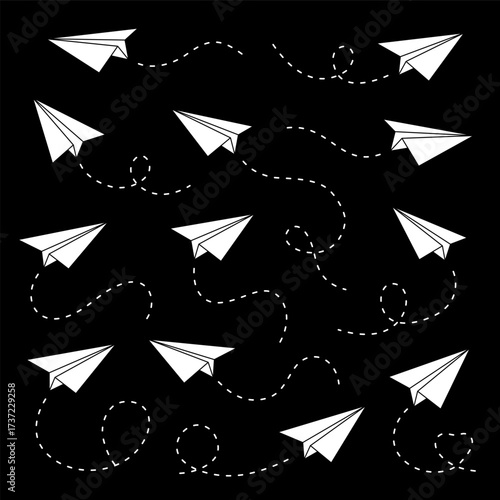 White paper airplanes on black background with dashed flight paths