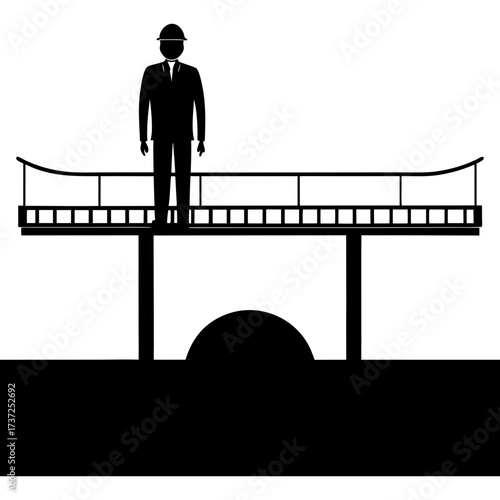 Man standing on a bridge with arch below silhouette