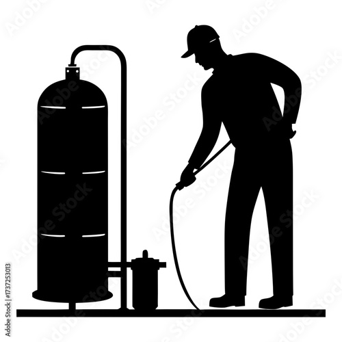 Man in silhouette spraying pesticide on large tank silhouette