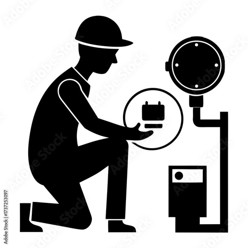 Worker in hard hat holding battery with equipment silhouette