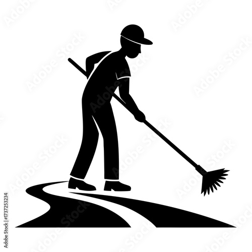 Person sweeping a path in silhouette