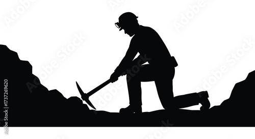 Silhouette of a miner digging with a pickaxe against a white background