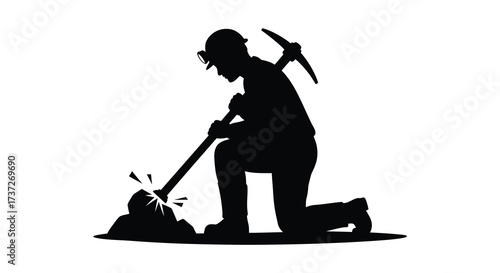Silhouette of a miner digging with pickaxe a classic labor scene