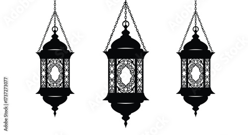 Elegant black lanterns suspended from chains detailed ornamental designs visible