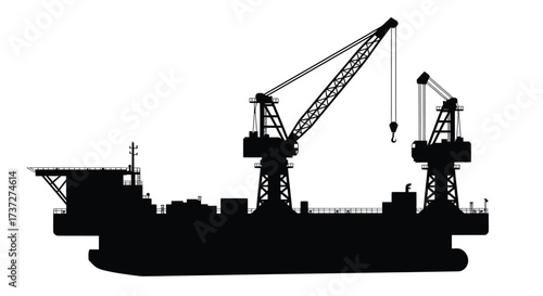 Silhouette of offshore oil platform with cranes and support structures