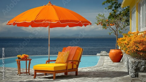 Orange parasol and lounge chair near pool overlooking ocean on a sunny day.