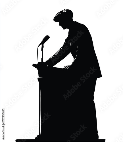 Silhouette of a speaker giving a presentation at a podium with a microphone
