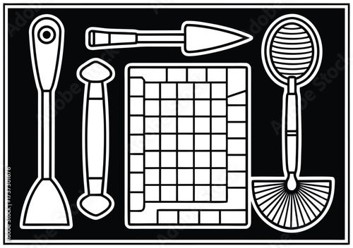 Collection of white makeup brushes and tools on a black background