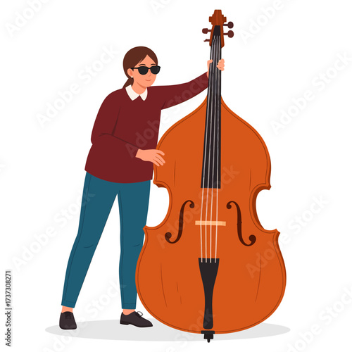 A woman in sunglasses standing next to a large upright double bass musical instrument on a white background.