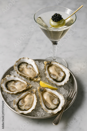 Fresh oysters on ice served with martini and caviar garnish