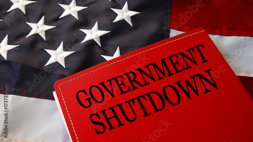 Government Shutdown text on red folder over American flag, symbol of political crisis, budget conflict, and federal closure