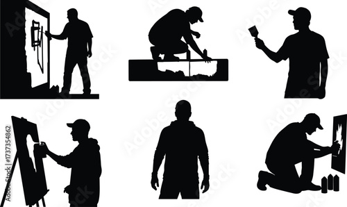 Silhouette artist painting, creative painter working, wall art creation, easel painting, crouching