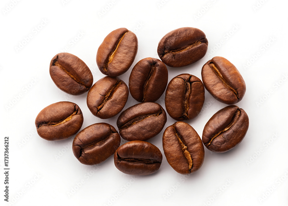 Naklejka premium Freshly roasted coffee beans isolated on white background. coffee texture close-up, top view.
