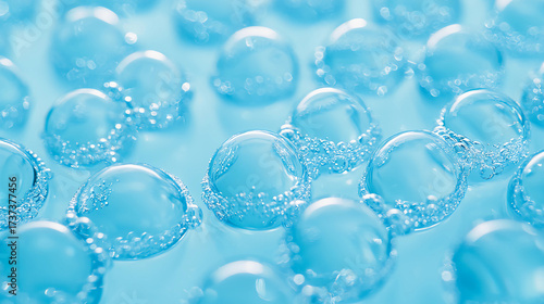 A close-up view of shimmering blue bubbles, capturing their delicate structure and reflecting light in a serene aquatic environment.