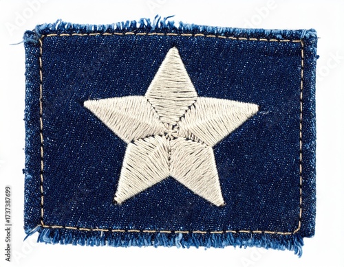 A denim rectangle with a white embroidered star, frayed edges on a white background
